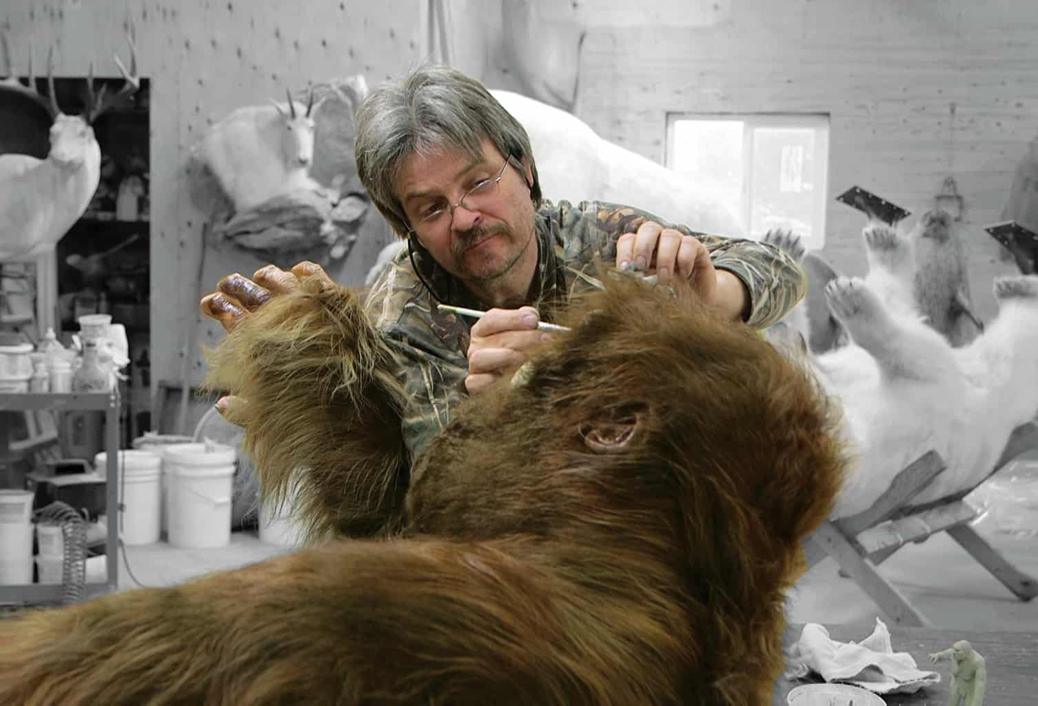 Taxidermist Ken Walker painting the eyeballs of Patty in the movie Big Fur. Image courtesy of Big Fur director Dan Wayne.
